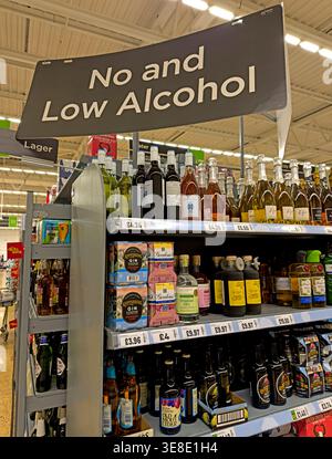 Asda supermarket No and Low Alcohol drinks aisle with beer, wine, spirits and cider alternatives on UK retail shelves, in Warrington, Cheshire, UK Stock Photo