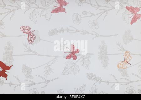 A delicate tapestry background featuring subtle gray floral line art and scattered red and pink butterflies on a light fabric surface. Stock Photo