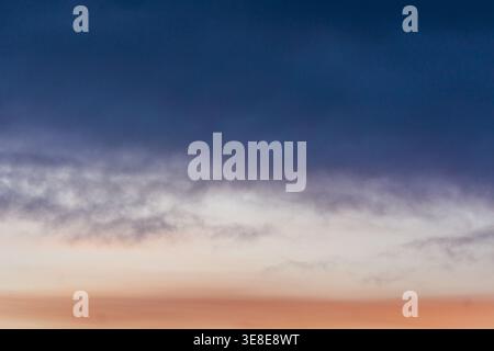 Gradient sky with soft clouds at sunset Stock Photo