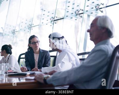 Middle Eastern corporate meeting with startup executives discussing strategy in a modern boardroom Stock Photo