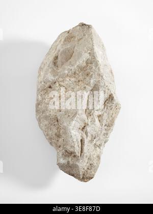 A large limestone rock on a white background. Close-up v2 Stock Photo