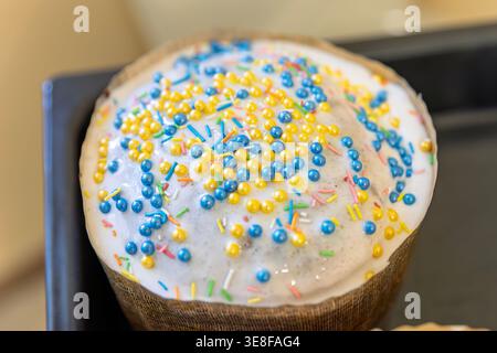 Traditional Easter Paska Cake with White Icing and Yellow Blue Beads Stock Photo