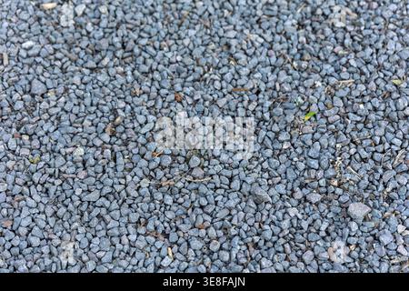 Background Texture of Grey Granite Gravel and Crushed Stone Stock Photo