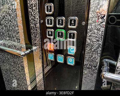 Elevator control panel with illuminated buttons in modern interior design. Mobile photo Stock Photo