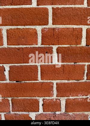 Brick wall texture with distinct red and beige color pattern, ideal for architectural background. Mobile photo Stock Photo
