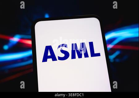 Paris, France - April 14, 2026: The ASML company logo displayed on a smartphone screen with an abstract light background representing technology. Stock Photo