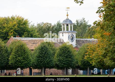 The historic stables and coach house at Dunham Massey Hall, a National Trust estate located near Altrincham in Cheshire, England Stock Photo