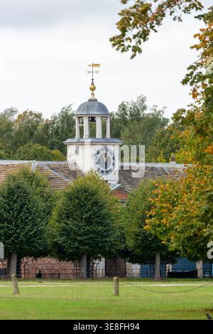 The historic stables and coach house at Dunham Massey Hall, a National Trust estate located near Altrincham in Cheshire, England Stock Photo
