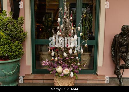 Decorated Easter Egg Tree Outside Green Door Stock Photo