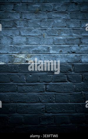 Two-tone dark painted brickwork Stock Photo