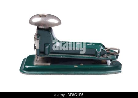 vintage green desk stapler with signs of usage on white background Stock Photo