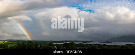 Double rainbow and clouds over a lake along the Ring of Kerry, Ireland Stock Photo
