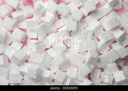 Many styrofoam cubes on pink background, top view Stock Photo
