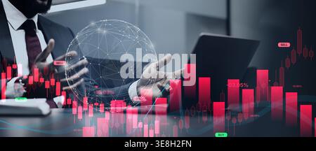 Businessman Analyzing Market Trends With Data Graphics in Office Setting During Daytime Hours Stock Photo