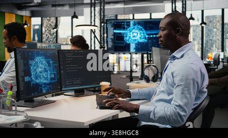 Software developers in startup office work with artificial intelligence driving market innovation. Tech agency IT experts apply deep learning to optimize operations and efficiency, camera A Stock Photo