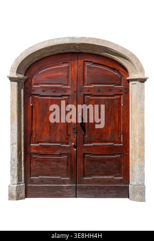 Classic antique wooden door in Italian Renaissance style, featuring with recessed panels, framed by a granite arch. Isolated on white, clipping path Stock Photo
