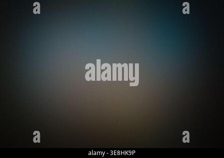 Grainy dark blue gradient background with soft vignette and copy space Stock Photo