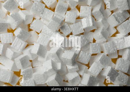 Many styrofoam cubes on yellow background, flat lay Stock Photo