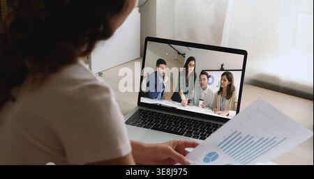 Cropped shot of young female project manager talking to colleagues Stock Photo