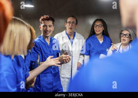 Medical staff collaborating and communicating during a meeting, sharing information and ideas to improve patient outcomes in a professional healthcare Stock Photo