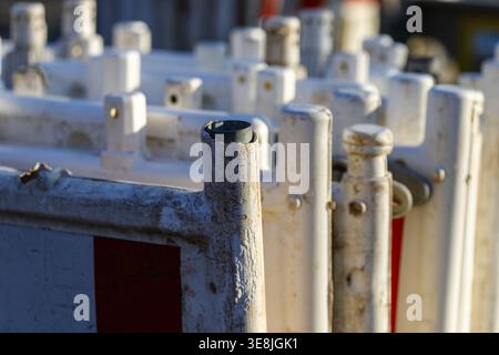 White and red plastic barriers for roadworks and construction sites Stock Photo