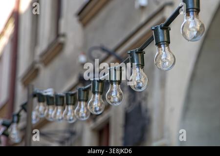 A lot of light bulbs on the cable Stock Photo