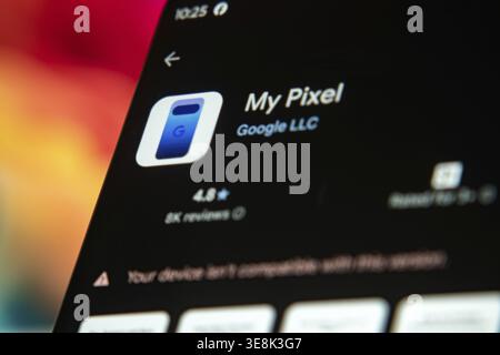 Dhaka, Bangladesh 07 Dec 2025:Google Pixel logo of app on the screen of mobile phone held by man in front of the laptop and tablet Stock Photo