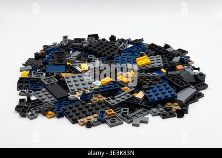 Large pile of diverse plastic LEGO building blocks isolated on white background. Stock Photo