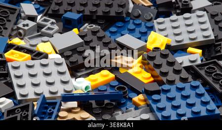 Top view of interlocking plastic LEGO construction bricks isolated on white background. Stock Photo