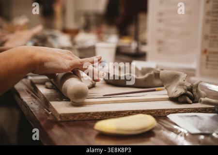 Hands Crafting Clay in Ceramics Art Class Stock Photo