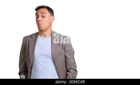 Man expressing skepticism with doubtful facial expression Stock Photo