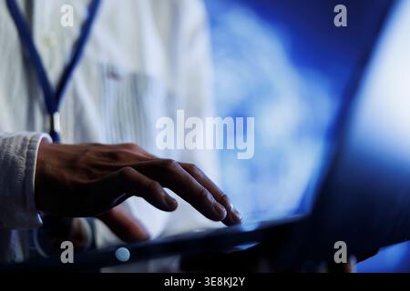 Certified engineer writes code on laptop to visualize artificial intelligence neural networks using augmented reality technology, close up. Data center expert runs AI script for information processing Stock Photo