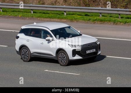 2026 White Chery Tiggo 7 Aspire Phev Auto 204 18.4Kwh DHT Auto Start/Stop Car SUV Hybrid Electric 1499 cc; travelling on the M61 motorway, UK Stock Photo