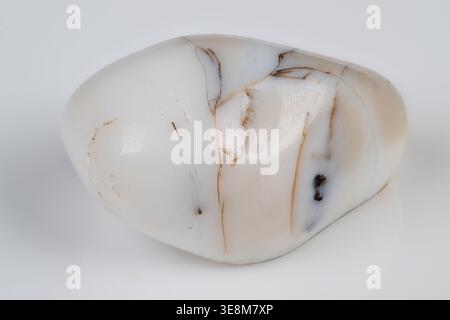 White polished marble pebble, brown veins studiolit on clean white background, smooth glossy surface, subtle translucence, closeup texture, ideal for Stock Photo