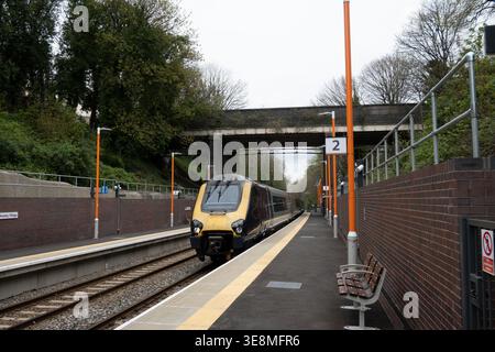 CrossCountry Voyager diesel train passing through Moseley Village station, Birmingham, West Midlands, UK Stock Photo