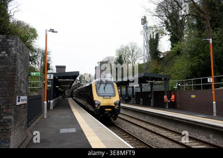 CrossCountry Voyager diesel train passing through Moseley Village station, Birmingham, West Midlands, UK Stock Photo