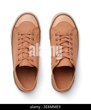 Top view of brown canvas sport shoes isolated on white Stock Photo