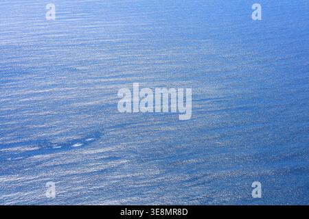 Sea water texture. Surface of Atlantic Ocean sparkling in the sun in Ireland. Abstract background. Stock Photo