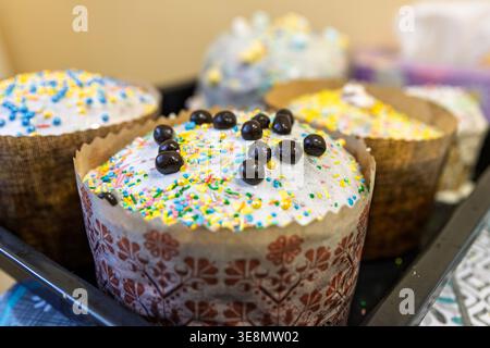 Easter Paska Cake with Chocolate Dragees and Colorful Sprinkles Stock Photo