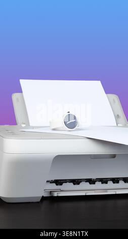 Printer in use with paper coming out and a watch nearby on a simple background Stock Photo