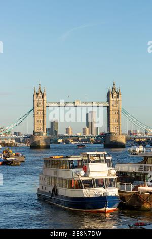 The Tower of London illuminated by late afternoon light seen from the River Thames, London Stock Photo