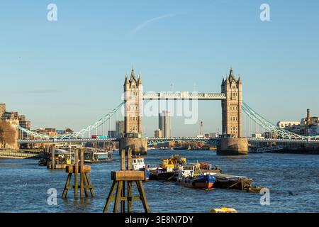 The Tower of London illuminated by late afternoon light seen from the River Thames, London Stock Photo