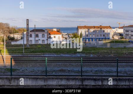 Creative abstract composition featuring a distorted urban scene in Lisbon, Portugal. Glitch-style visual effect blends architectural elements, sky, an Stock Photo