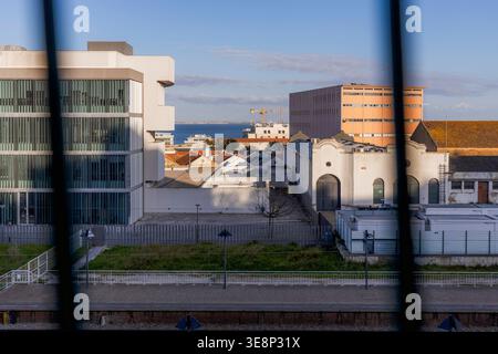 Creative abstract composition featuring a distorted urban scene in Lisbon, Portugal. Glitch-style visual effect blends architectural elements, sky, an Stock Photo
