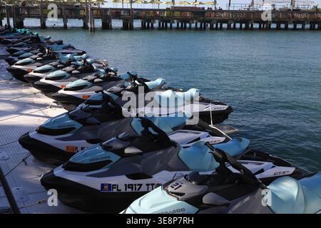 KEY WEST, FLORIDA, USA - OCTOBER 27, 2025: A fleet of modern Sea-Doo jet skis lined up at a floating dock in Key West, ready for rental and tropical o Stock Photo