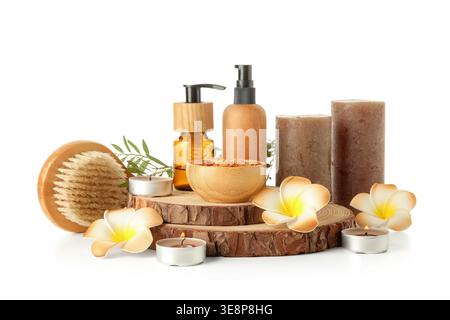 Set of spa accessories with candles and plumeria flowers on white background Stock Photo