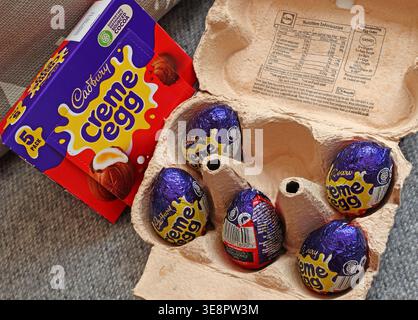 Five Cadbury Creme Eggs in egg box. Stock Photo