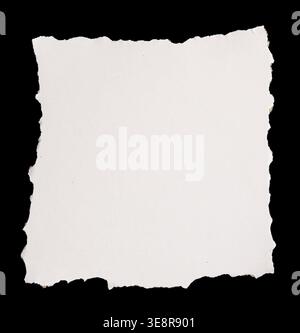 Ripped paper on black background Stock Photo