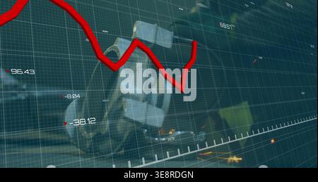 Displaying red jagged line graph cutting across factory numeric grid overlay, showing engine sparks Stock Photo