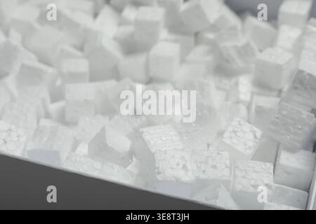 Closeup view of cardboard box with styrofoam cubes Stock Photo